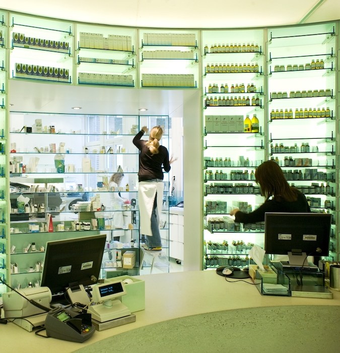 Two women working at the pharmacy. 