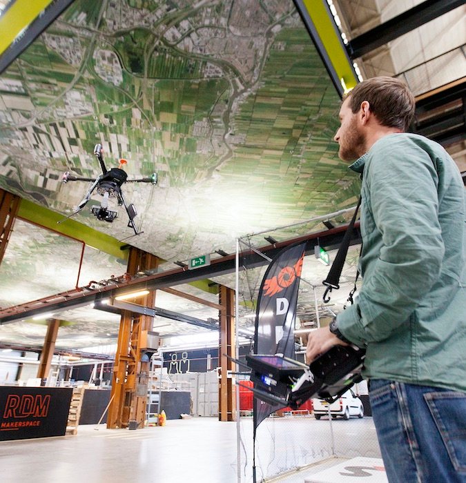 Man using a drone at the Dutch Drone company. 