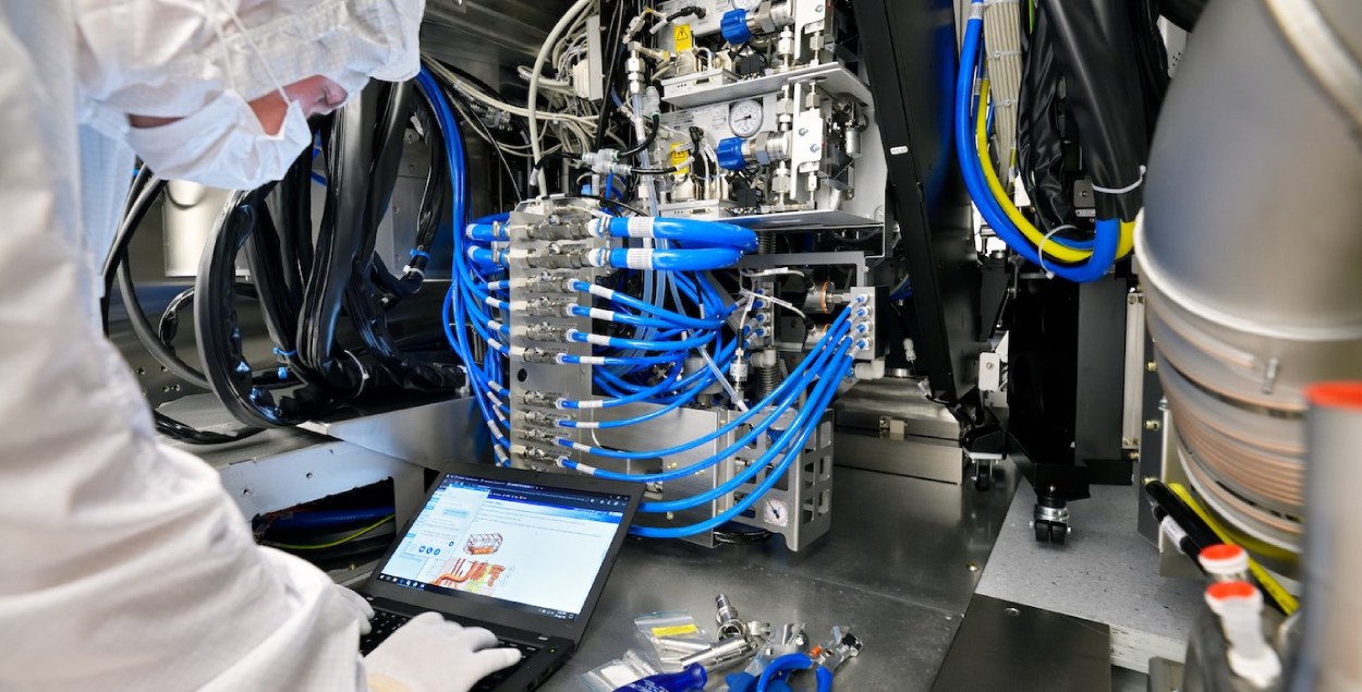 Employee working with a machine at ASML in Eindhoven