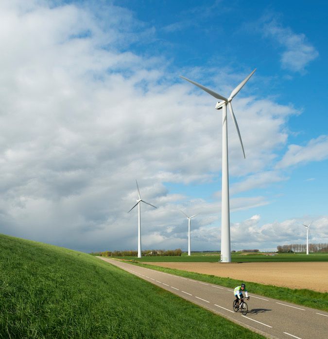 Grass land with a windmill.