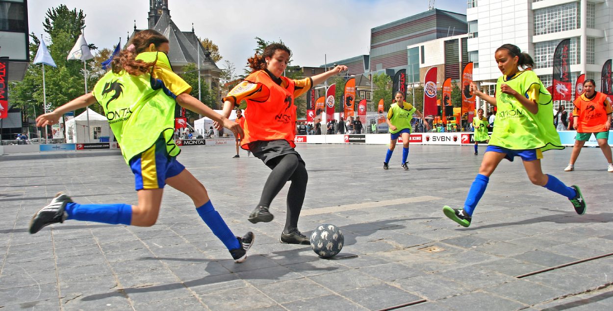 Children playing soccer. 