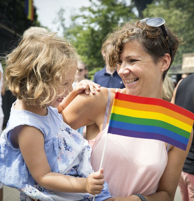 Women with her little girl at the pride. 