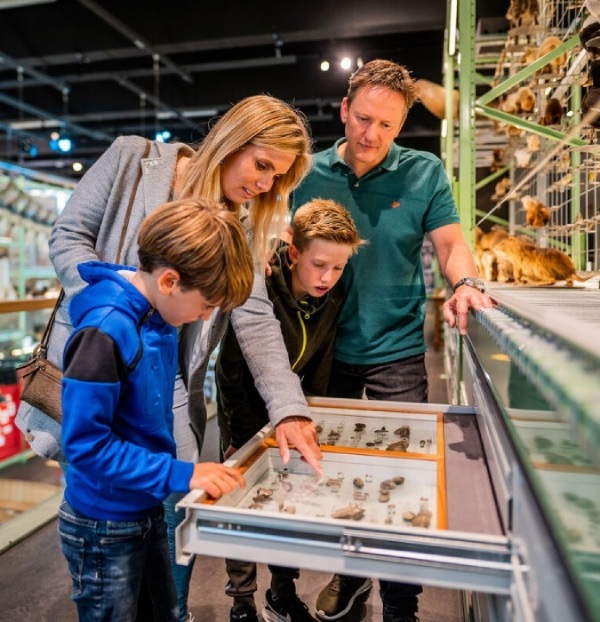 Family visiting a museum called Naturalis in Leiden. 