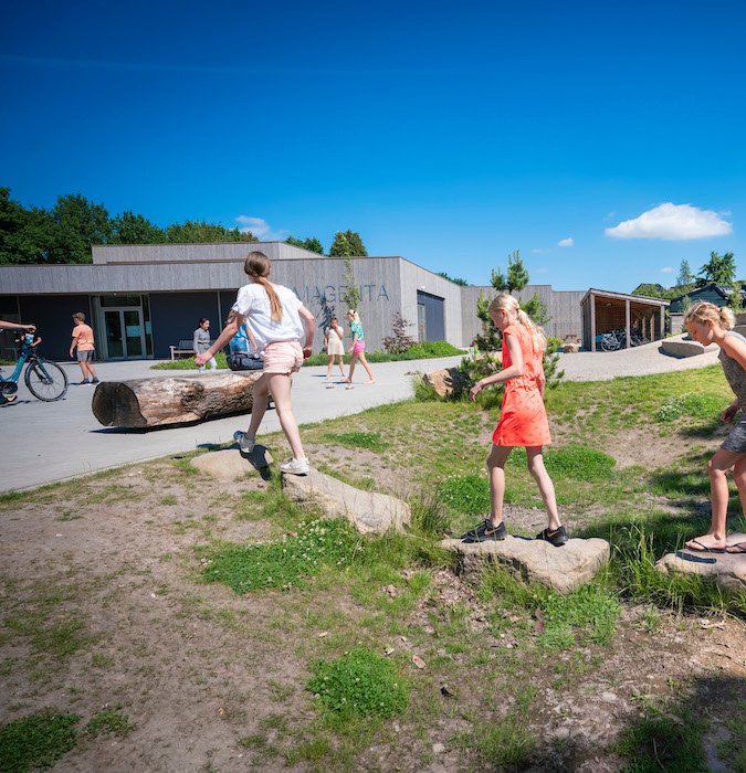 Children playing outside in the schoolyard. 