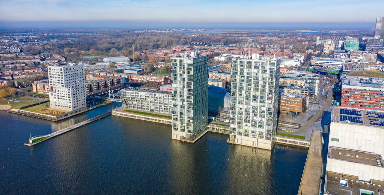 Sky picture of Flevoland with buildings near the wather.  