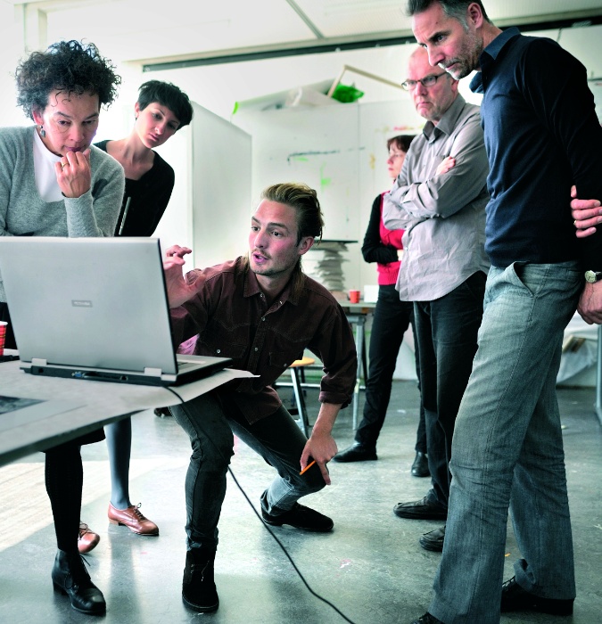 Students looking at a computer 